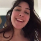 A very cute girl shits into a toilet from under ass. A short hang, then pissing over the product in the bowl. Filmed from a between the legs perspective. Vertical format video. Under a minute.